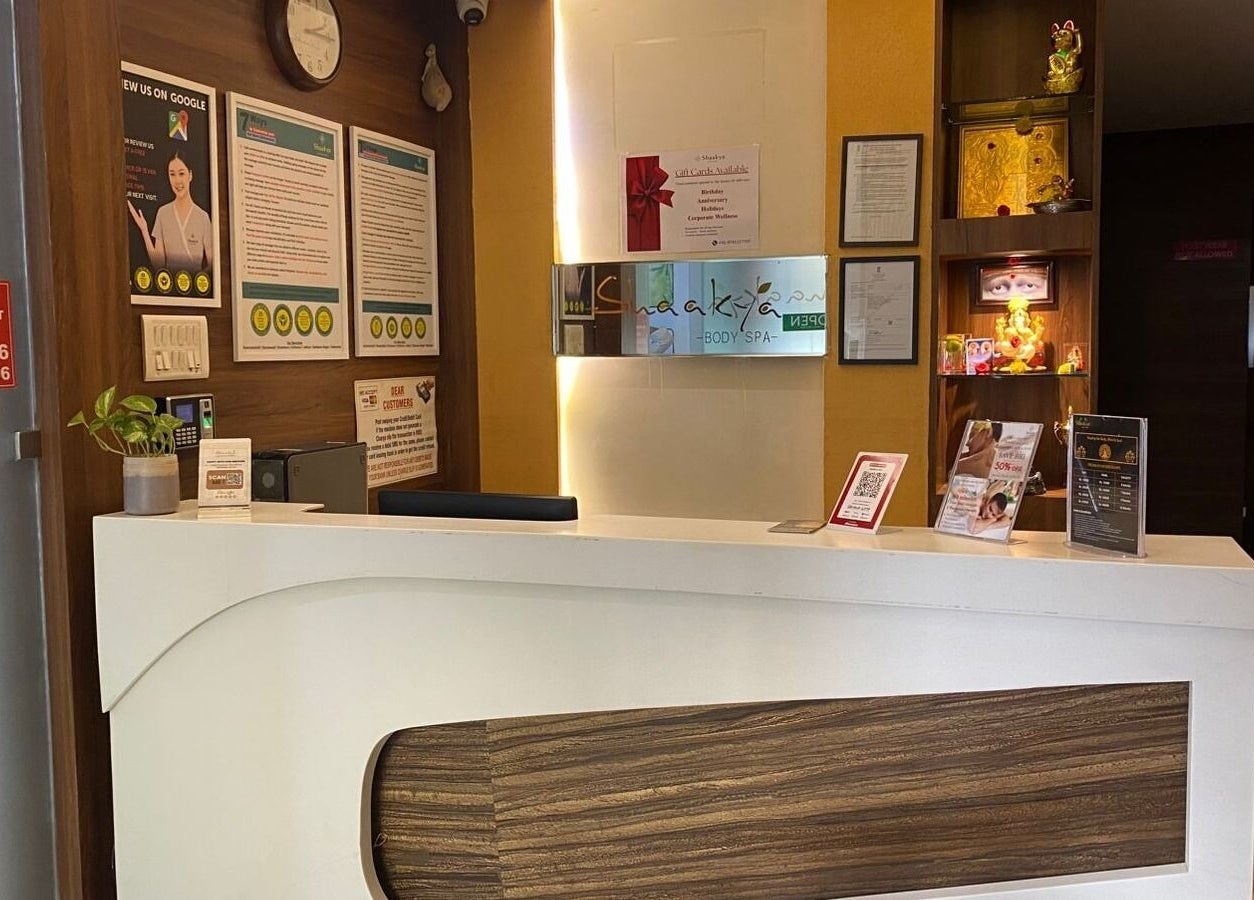 Reception area at Shaakya Spa & Wellness, Bengaluru, Karnataka, IN, featuring elegant decor and warm ambiance.