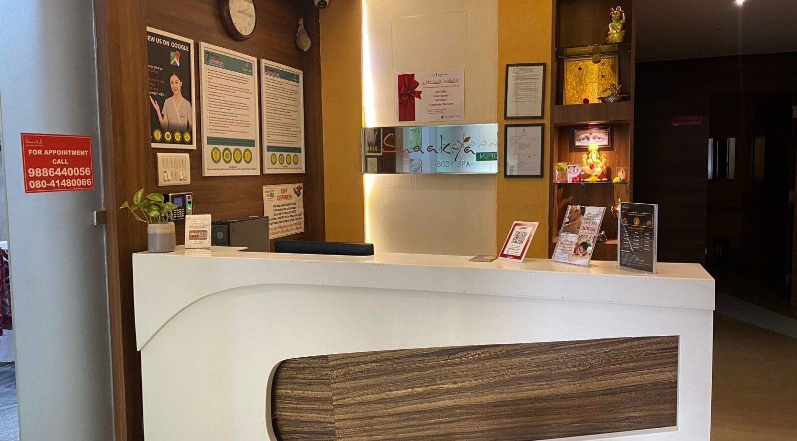 Reception area at Shaakya Spa & Wellness, Bengaluru, Karnataka, IN, featuring elegant decor and warm ambiance.