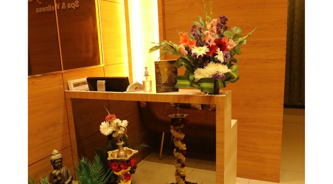 Reception area at Shaakya Spa & Wellness, Bengaluru, Karnataka, IN with vibrant floral decor.