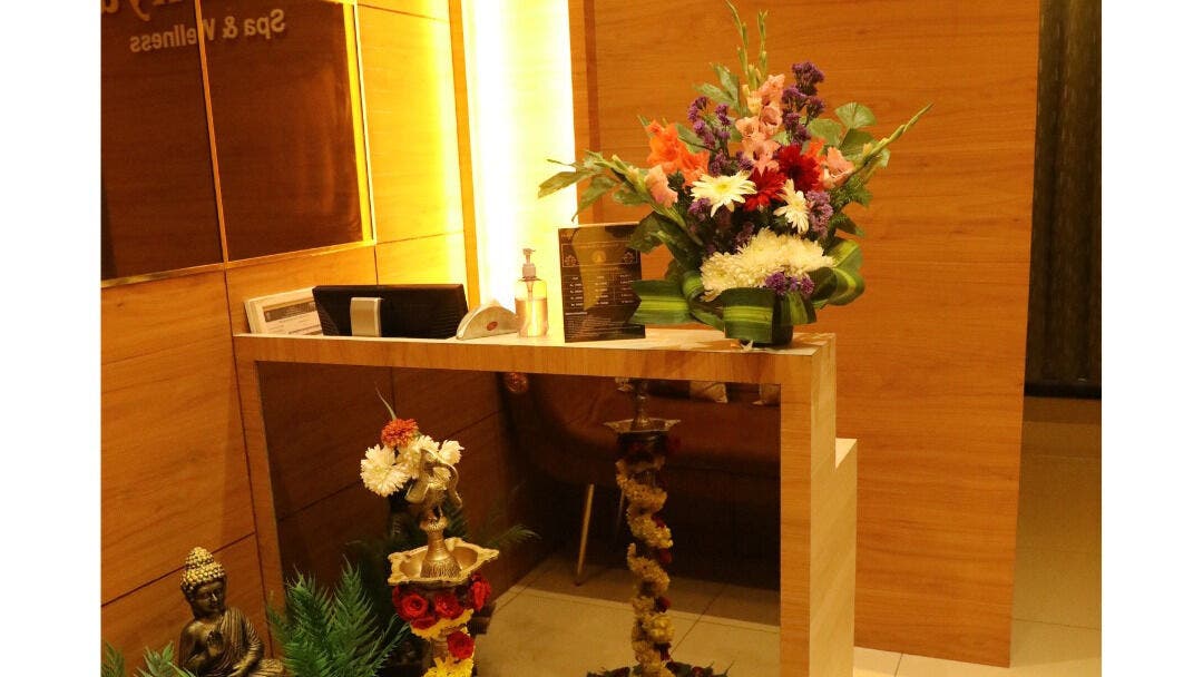 Reception area at Shaakya Spa & Wellness, Bengaluru, Karnataka, IN with vibrant floral decor.