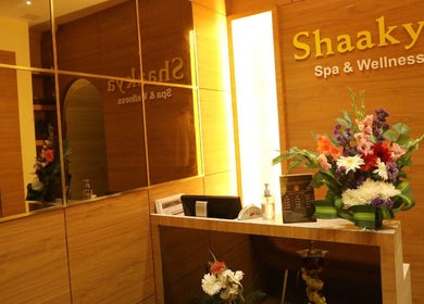 Reception area of Shaakya Spa & Wellness in Bengaluru, Karnataka, IN with floral decor and serene lighting.