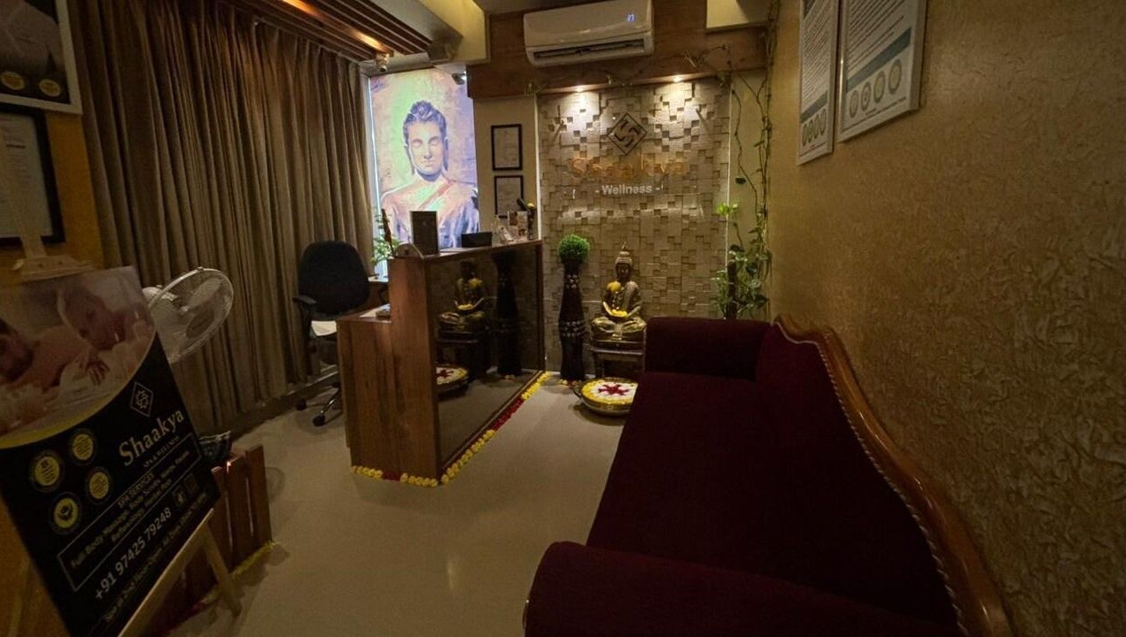 Reception area at Shaakya Spa & Wellness, Bengaluru, Karnataka, IN, featuring serene Buddha decor.
