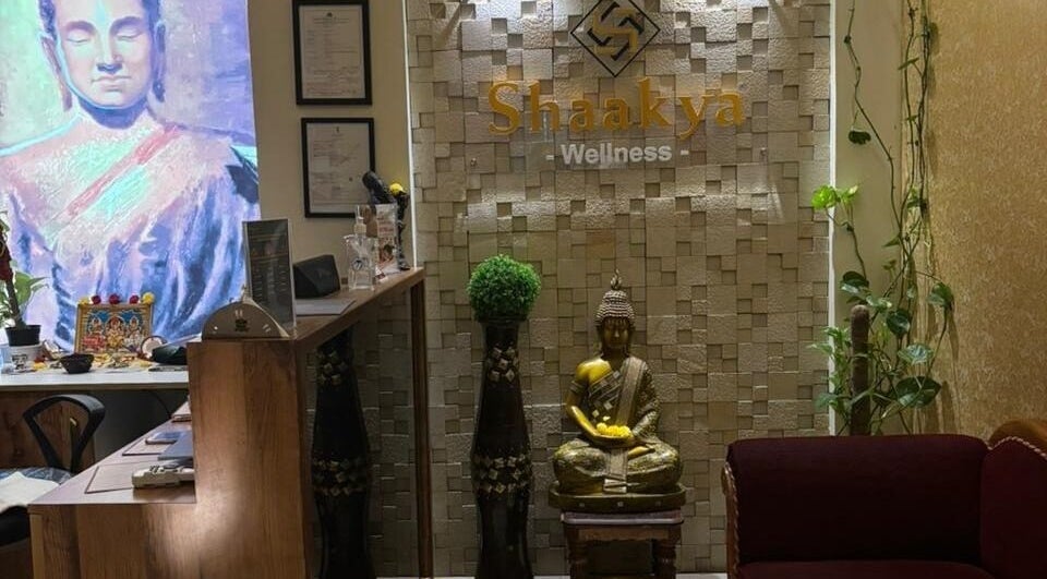 Reception area of Shaakya Spa & Wellness in Bengaluru, Karnataka, IN, featuring serene Buddha decor.