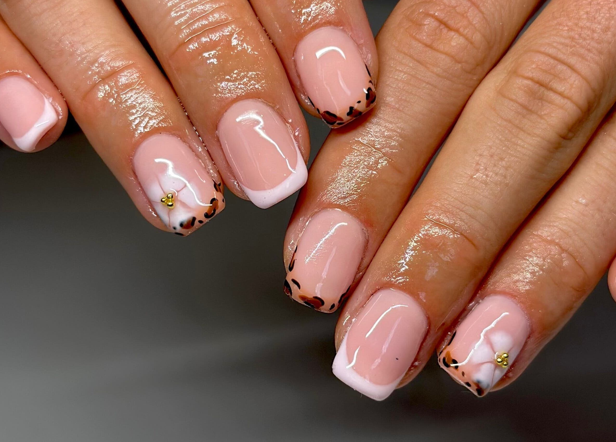 Elegant leopard nail art by Nails By Lauren, Crawley, England, GB. Glossy finish and stylish design.