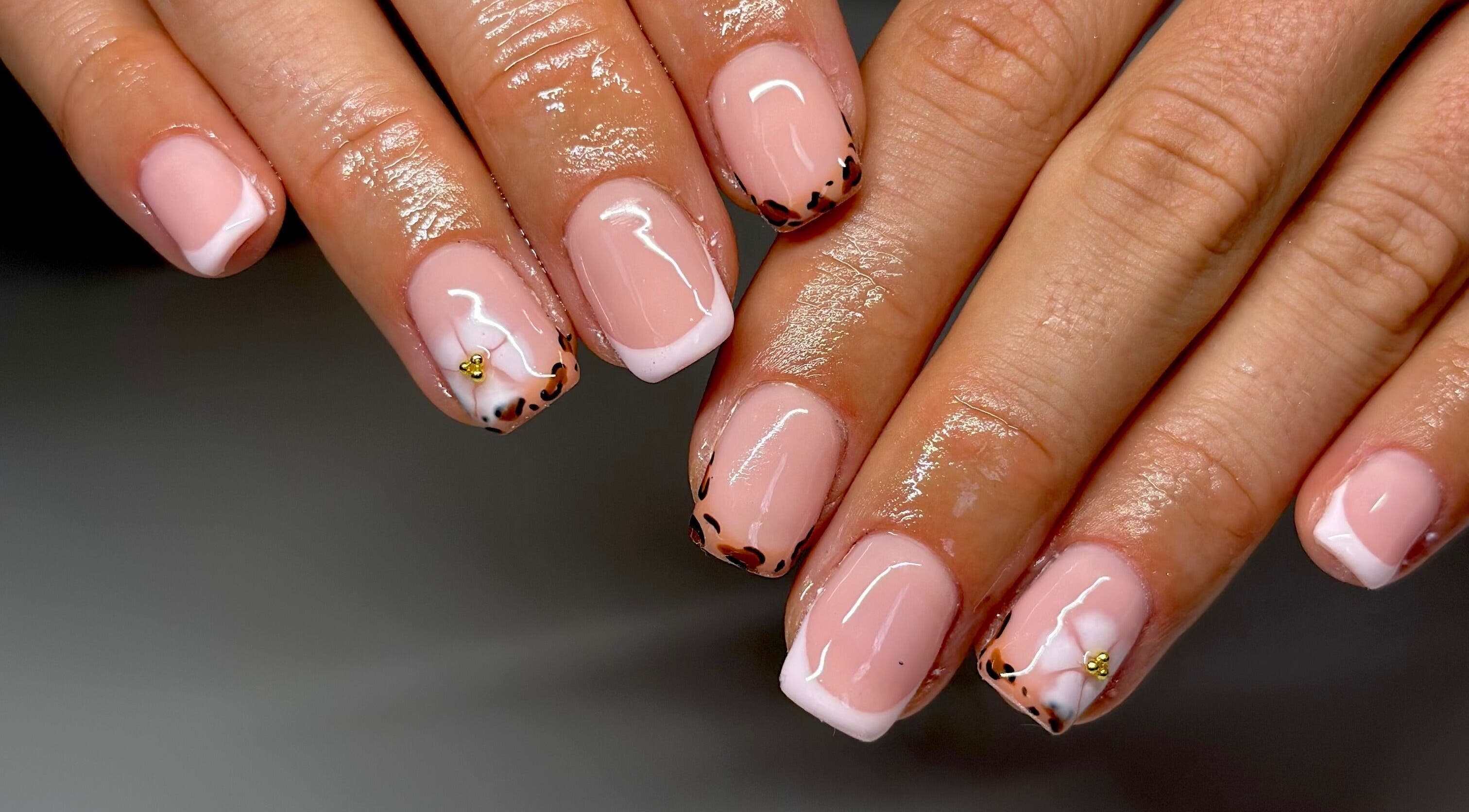 Elegant leopard nail art by Nails By Lauren, Crawley, England, GB. Glossy finish and stylish design.