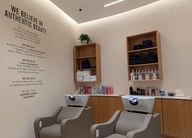 Modern wash station at Class and Creation Ladies Beauty Salon, Abu Dhabi, AE, with products and stylish decor.