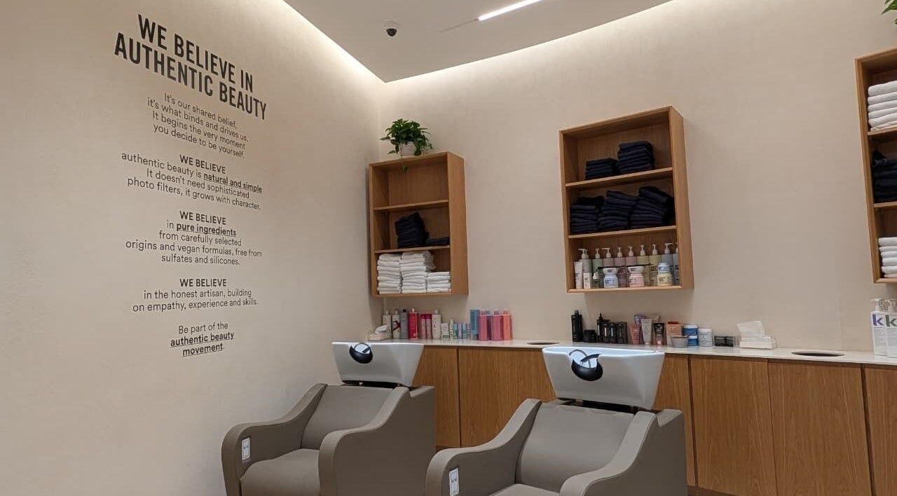Class and Creation Ladies Beauty Salon in Abu Dhabi, AE, showcasing sleek hair washing stations and product shelves.