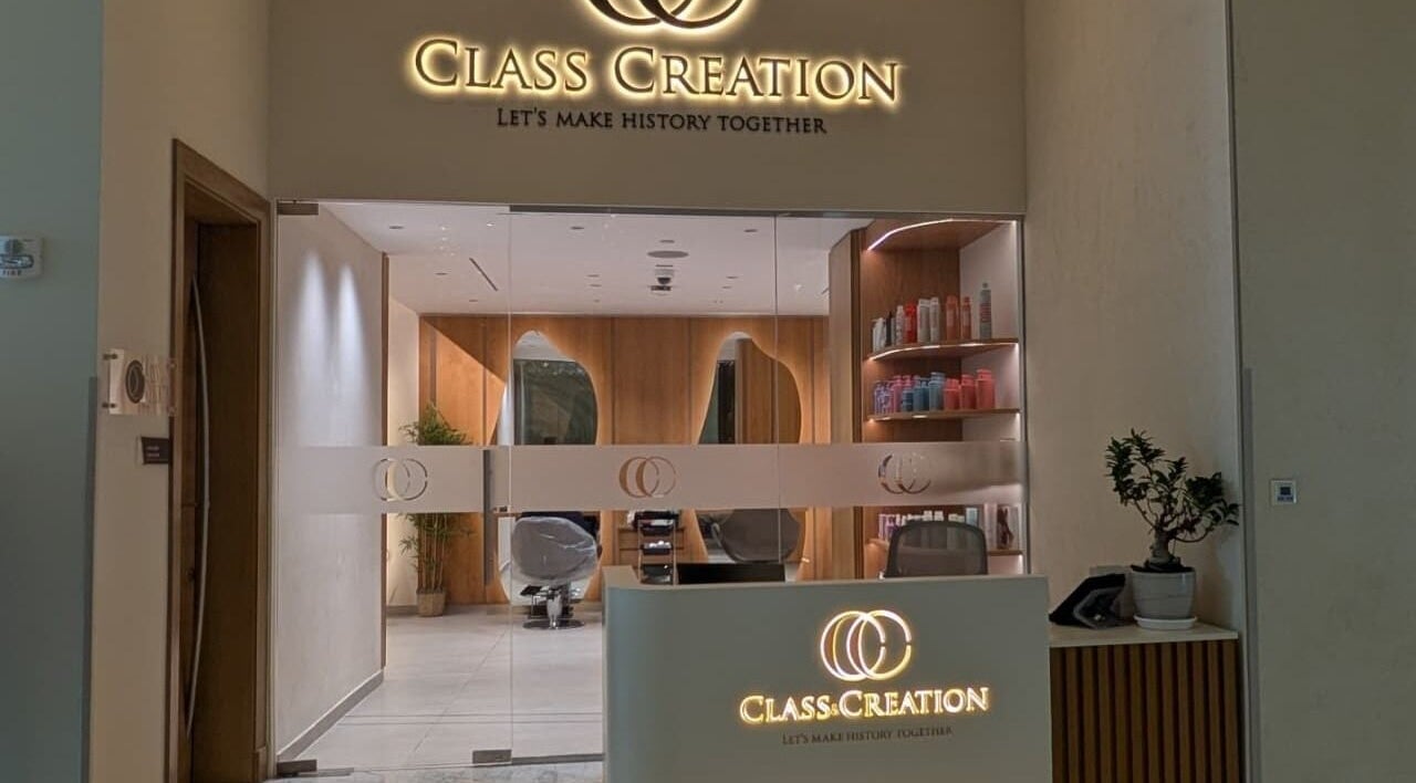 Entrance of Class and Creation Ladies Beauty Salon in Abu Dhabi, AE, showing stylish interior and products.