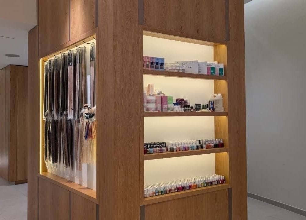 Product display at Class and Creation Ladies Beauty Salon in Abu Dhabi, AE, featuring hair extensions and beauty products.
