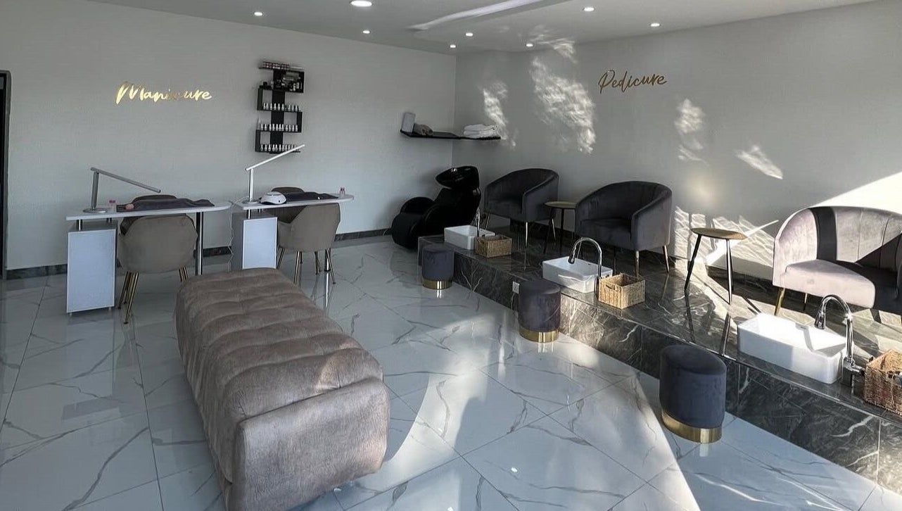 Elegant interior of Lukanda Beauty Center in Lusaka, Lusaka Province, ZM showcasing manicure and pedicure stations.