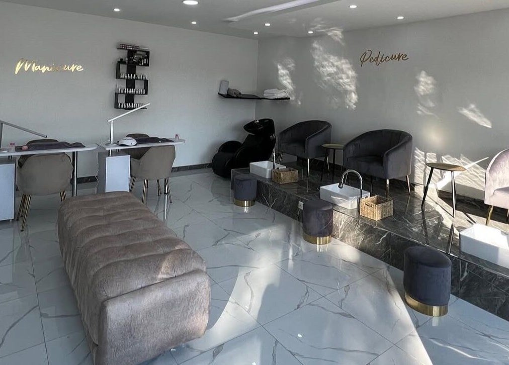 Elegant interior of Lukanda Beauty Center in Lusaka, Lusaka Province, ZM showcasing manicure and pedicure stations.