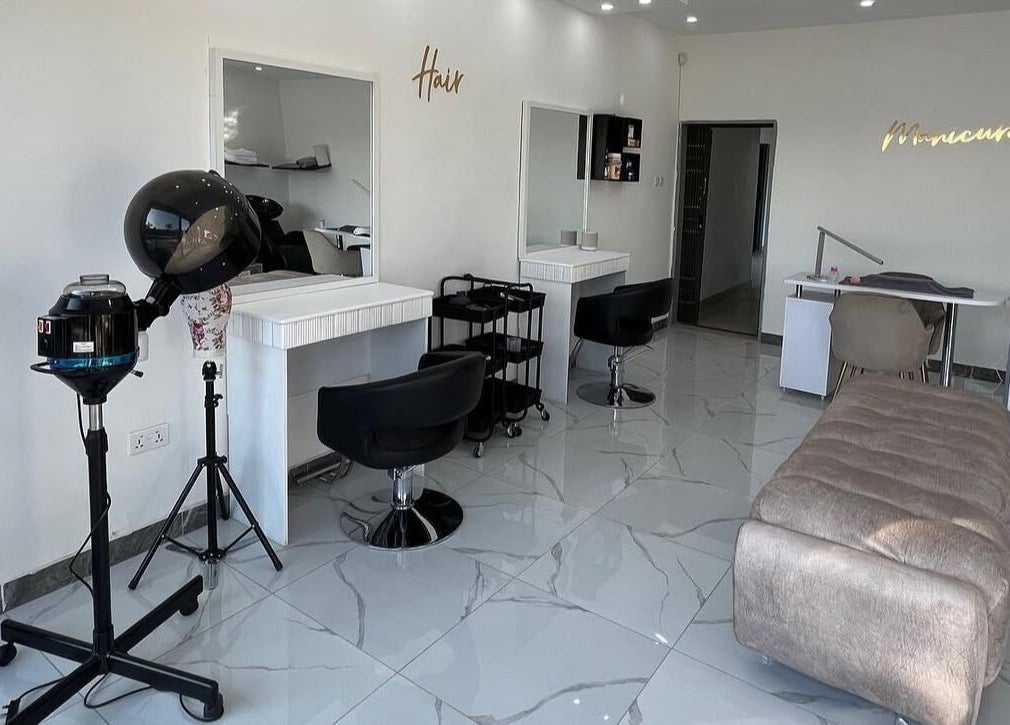 Modern salon interior at Lukanda Beauty Center, Lusaka with sleek styling stations and elegant design.