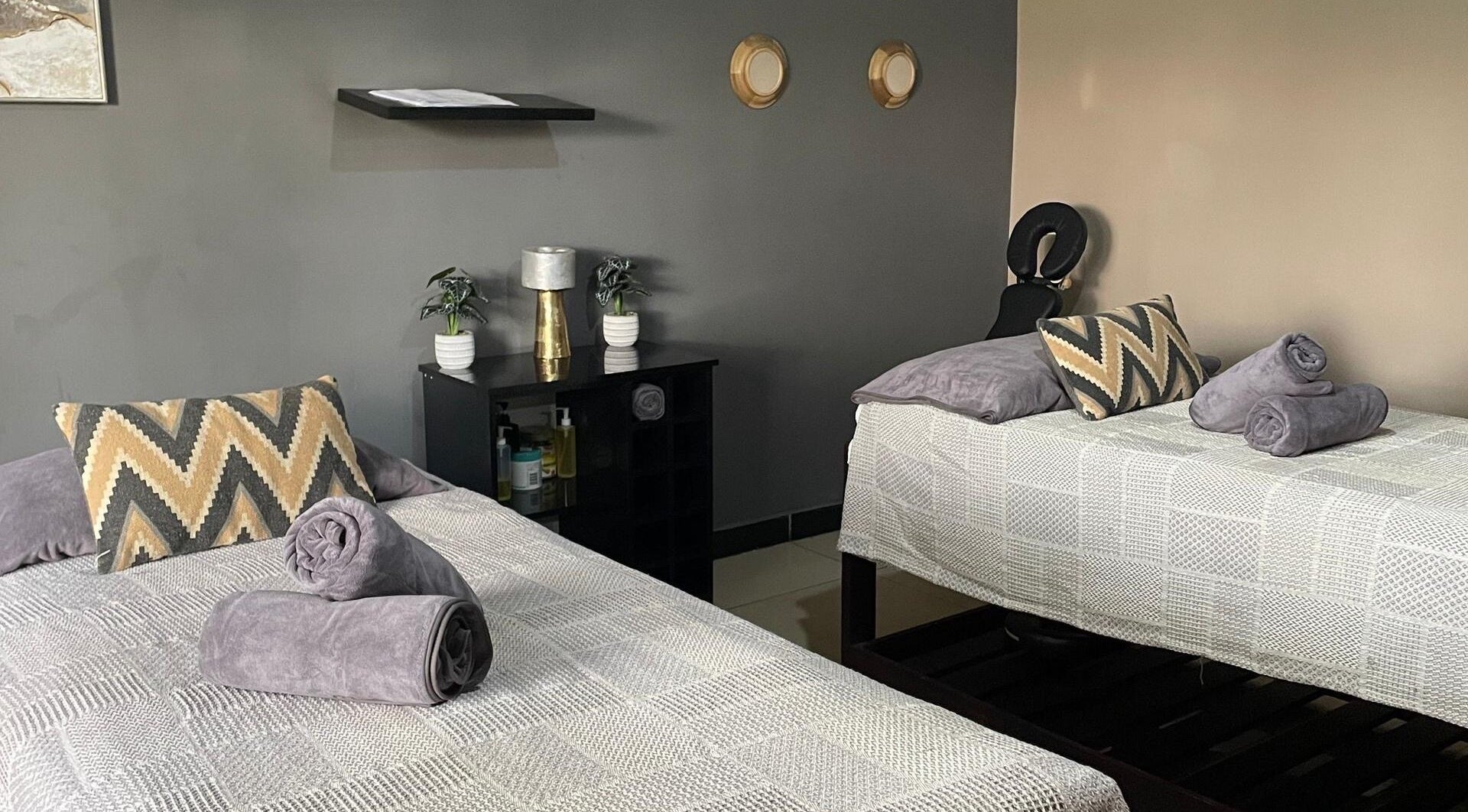Serene massage room at Lukanda Beauty Center, Lusaka, Lusaka Province, ZM, featuring two cozy beds.