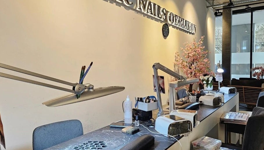 Modern nail salon interior at Lac Nails in Zürich, Zürich, CH with elegant decor and workstations.