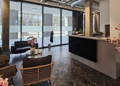Sophisticated lobby of Lac Nails in Zürich, Zürich, CH with modern decor and cherry blossoms.