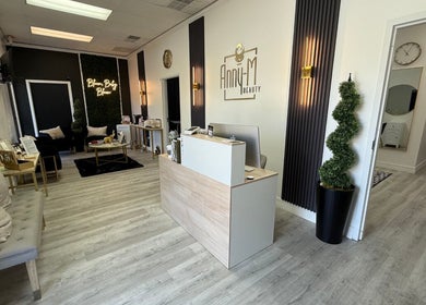 Reception area of Anny-M Beauty Lounge, Orlando, Florida, US, showcasing chic modern decor.