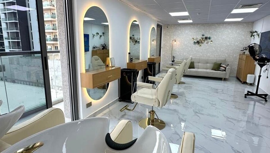 Bright interior of Bellavue Beauty Salon in Dubai, Dubai, AE with stylish mirrors and seating.