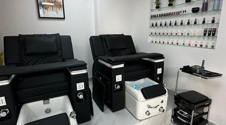 Elegant pedicure chairs in Bellavue Beauty Salon, Dubai, Dubai, AE. Stylish nail polish display enhances the ambiance.