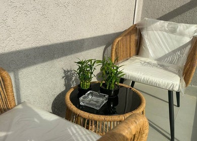 Cozy seating area with plants at Bellavue Beauty Salon, Dubai, Dubai, AE, offering a relaxing atmosphere.