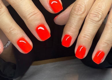 Bright red gel nails at BrauntonGels, Braunton, England, GB showcasing expert manicure service.