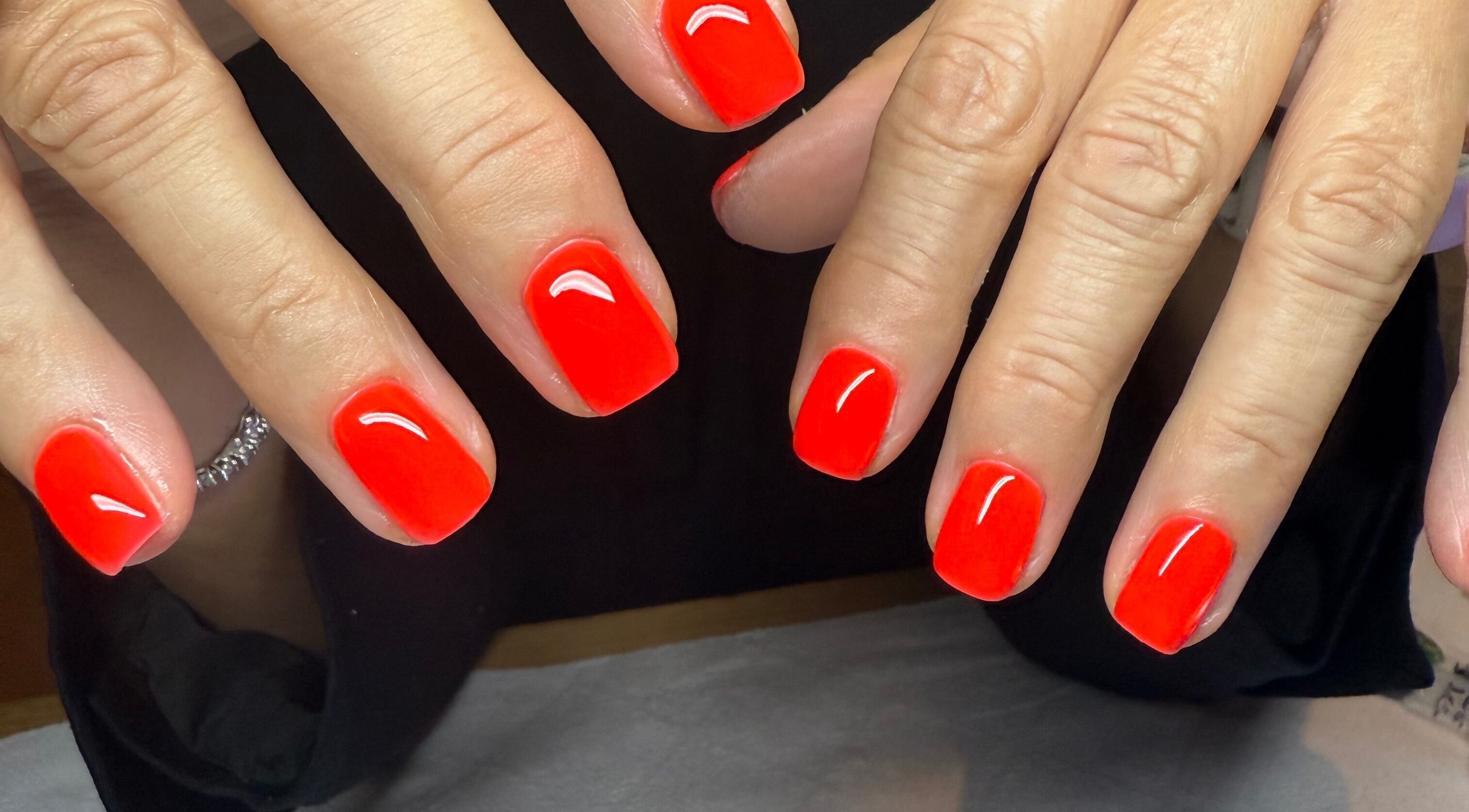 Bright red gel nails at BrauntonGels, Braunton, England, GB showcasing expert manicure service.