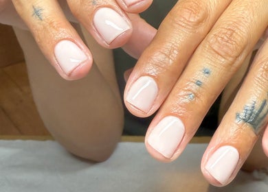 Close-up of freshly polished nails at BrauntonGels, Braunton, England, GB. Elegant and glossy manicure finish.