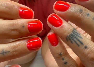 Stylish red gel manicure at BrauntonGels, Braunton, England, GB, showcasing vibrant nail art.
