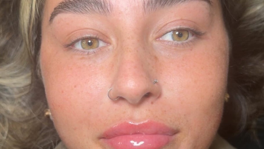 Close-up of a woman's face with glowing skin at Elite Aesthetics by Charlene, Merthyr Tydfil, Cymru, GB.