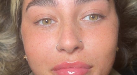 Close-up of a woman's face with glowing skin at Elite Aesthetics by Charlene, Merthyr Tydfil, Cymru, GB.