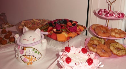 Delightful dessert spread at KLAWZ BY KAYLA, Maroubra, New South Wales, AU featuring doughnuts and fresh fruit.