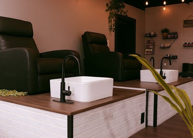 Luxurious pedicure chairs at Studio C by Carolyn Romero, Altamonte Springs, Florida, US. Elegant spa setup.