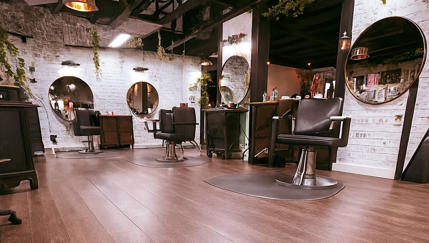 Interior of Studio C by Carolyn Romero, Altamonte Springs, Florida, US with stylish salon chairs and mirrors.