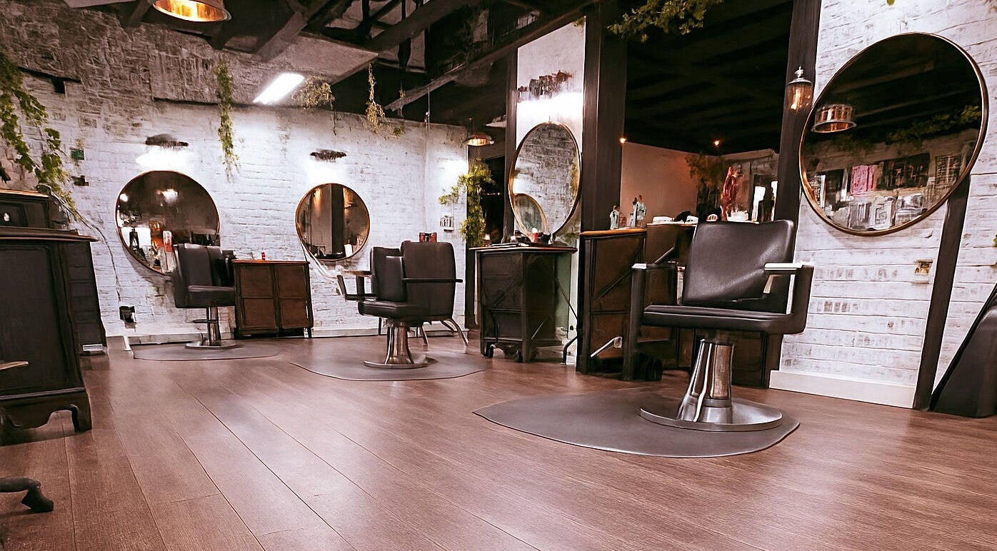 Interior of Studio C by Carolyn Romero, Altamonte Springs, Florida, US with stylish salon chairs and mirrors.