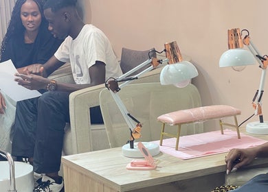 Customers discussing nail service at Tenaj Nails & Beauty, Accra, Greater Accra Region, GH.