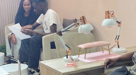 Customers discussing nail service at Tenaj Nails & Beauty, Accra, Greater Accra Region, GH.