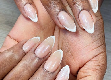 Stylish French manicure at Tenaj Nails & Beauty, Accra, Greater Accra Region, GH showcasing elegant nail art.