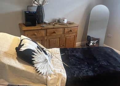 Relaxing treatment room at Skin Secrets By Jess, Park Gate, England, GB with a cozy bed and elegant decor.