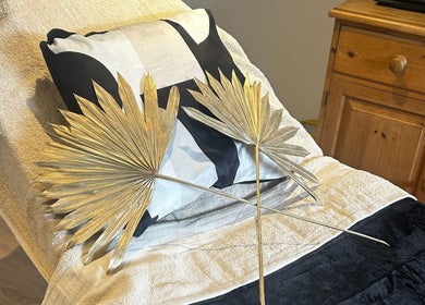 Luxurious treatment bed at Skin Secrets By Jess, Park Gate, England, adorned with golden palm decor.