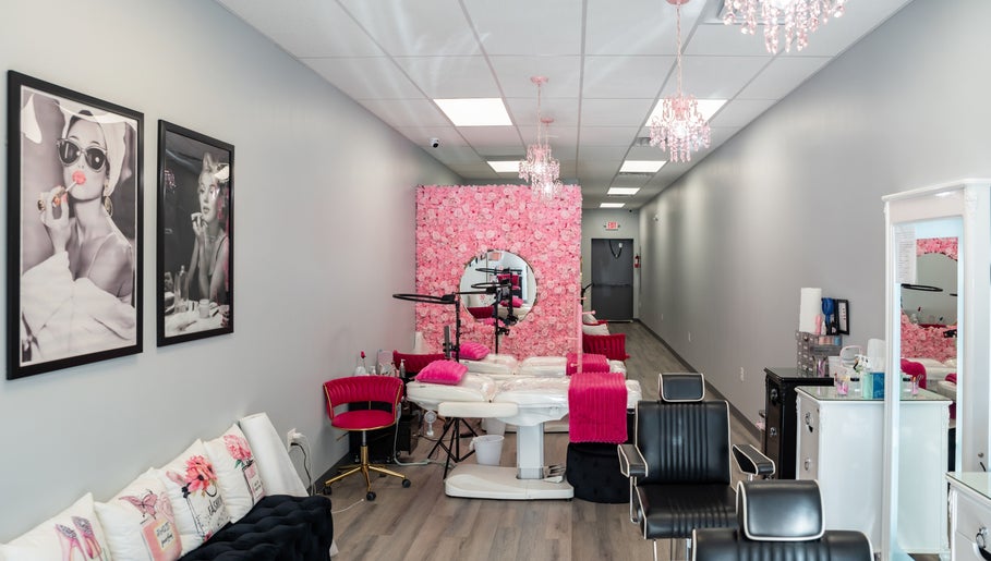 Elegant interior of Babe Brows Lash Lounge By Liz, Massapequa Park, NY with pink floral wall and stylish decor.