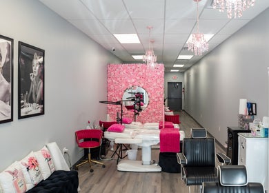 Elegant interior of Babe Brows Lash Lounge By Liz, Massapequa Park, NY with pink floral wall and stylish decor.