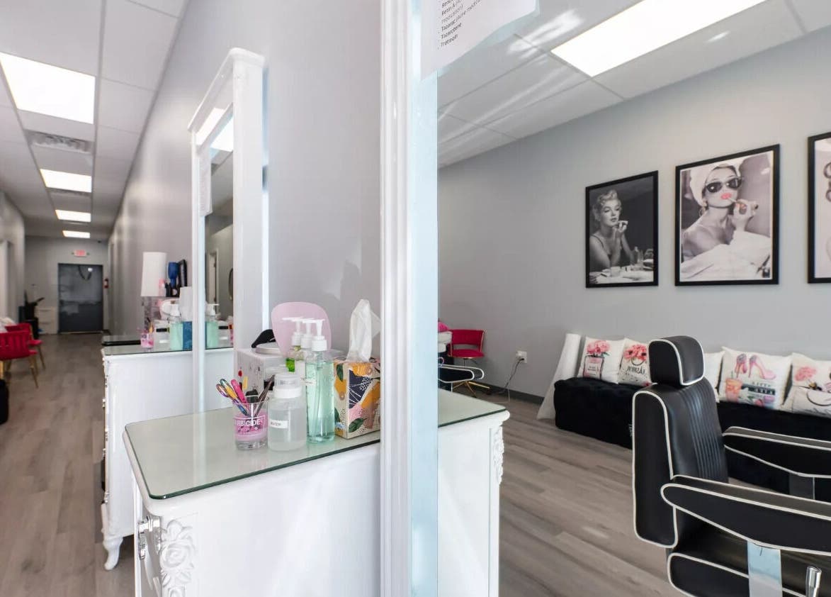 Modern interior of Babe Brows Lash Lounge By Liz in Massapequa Park, New York, US, featuring stylish decor and seating.