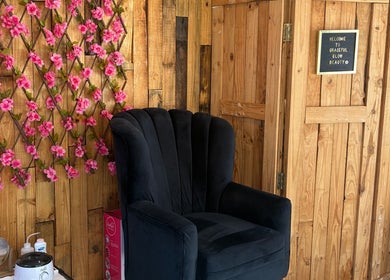 Cozy seating with floral decor at Graceful Glow Beauty in Vanderbijlpark, Gauteng, ZA.