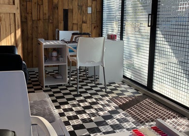 Graceful Glow Beauty salon interior in Vanderbijlpark, Gauteng, ZA with checkered flooring and wooden walls.