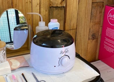 Beauty tools at Graceful Glow Beauty, Vanderbijlpark, Gauteng, ZA includes wax warmer and skincare products.