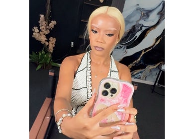 Woman taking a selfie at Beauté Bank, Linden, Upper Demerara-berbice, GY, showcasing beauty trends.