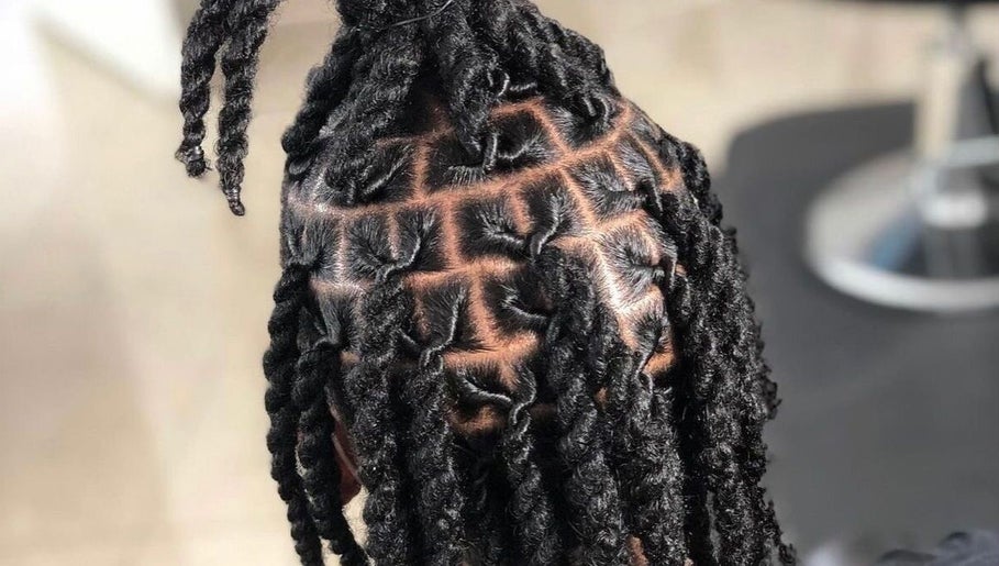 Intricate locs style at The Loc’d Shop in Nassau, New Providence, BS, showcasing expert hairstyling skills.