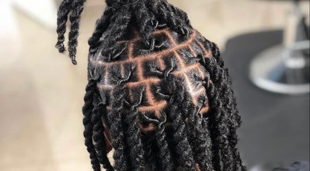 Intricate locs style at The Loc’d Shop in Nassau, New Providence, BS, showcasing expert hairstyling skills.