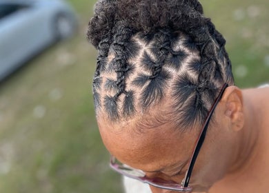 Creative braided hairstyle at The Loc’d Shop, Nassau, New Providence, BS.