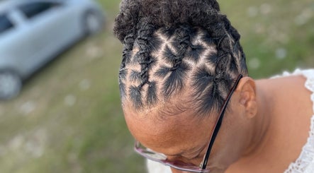 Creative braided hairstyle at The Loc’d Shop, Nassau, New Providence, BS.