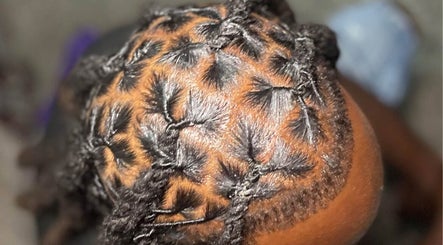 Intricate loc hairstyle at The Loc’d Shop, Nassau, New Providence, BS.